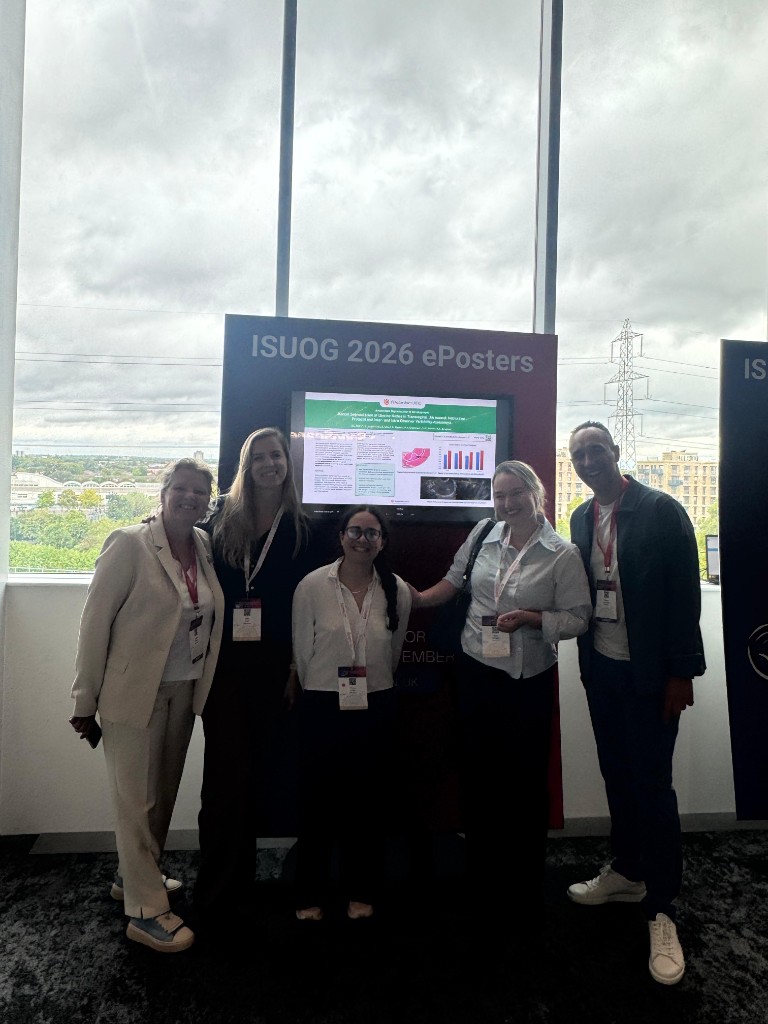 WomAIn team in front of an ePoster on manual segmentation of uterine niches